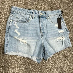 NWT Blank NYC distressed denim short. Size 28. Waist flat 15”. Rise 10.5”.