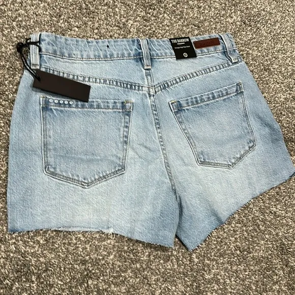 NWT Blank NYC distressed denim short. Size 28. Waist flat 15”. Rise 10.5”.