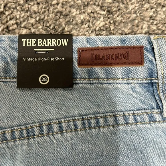 NWT Blank NYC distressed denim short. Size 28. Waist flat 15”. Rise 10.5”.